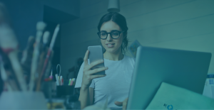 woman looking at her cell phone with glasses
