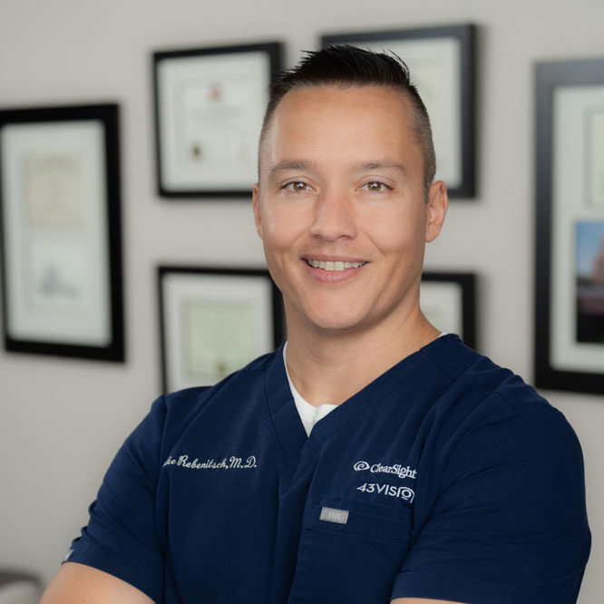 Dr. Luke Rebenitsch MD with Clearsight LASIK and Lens is pictured. He is an ophthalmologist specializing in LASIK, Custom Lens Replacement, and all forms of surgical vision correction. He is here to help people with their vision needs. He is very experienced and Clearsight is the best option for care.
