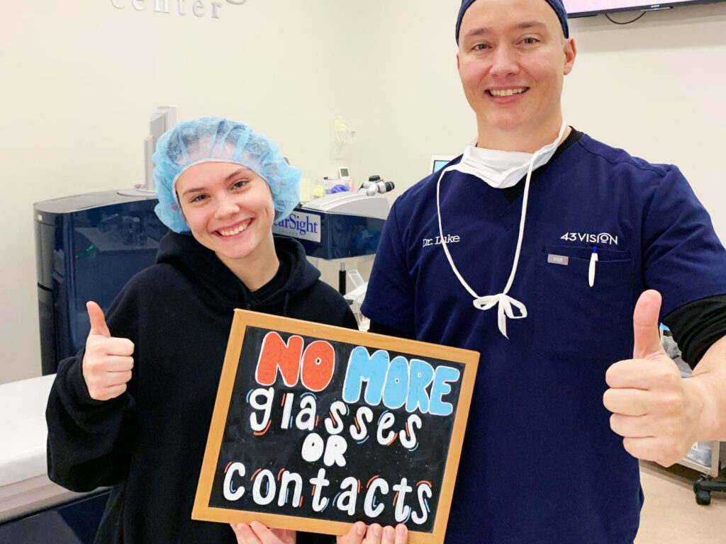 Dr. Luke Rebenitsch MD - Clearsight LASIK and Lens - is with a patient celebrating her successful LASIK eye surgery. She doesn't need to wear glasses or contacts anymore.