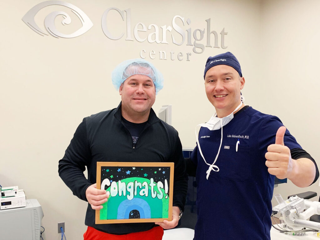 Dr. Luke Rebenitsch MD - Clearsight LASIK and Lens - with a patient at a Clearsight center celebrating his successful Clearsight LASIK surgery.