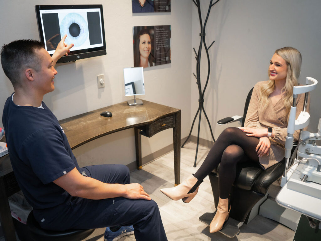 During an examination, Dr. Luke Rebenitsch MD - Clearsight LASIK and Lens - is telling a patient their options for eye care. They are happily discussing options for their vision needs. At Clearsight LASIK and Lens, the doctors aren't happy until you are.